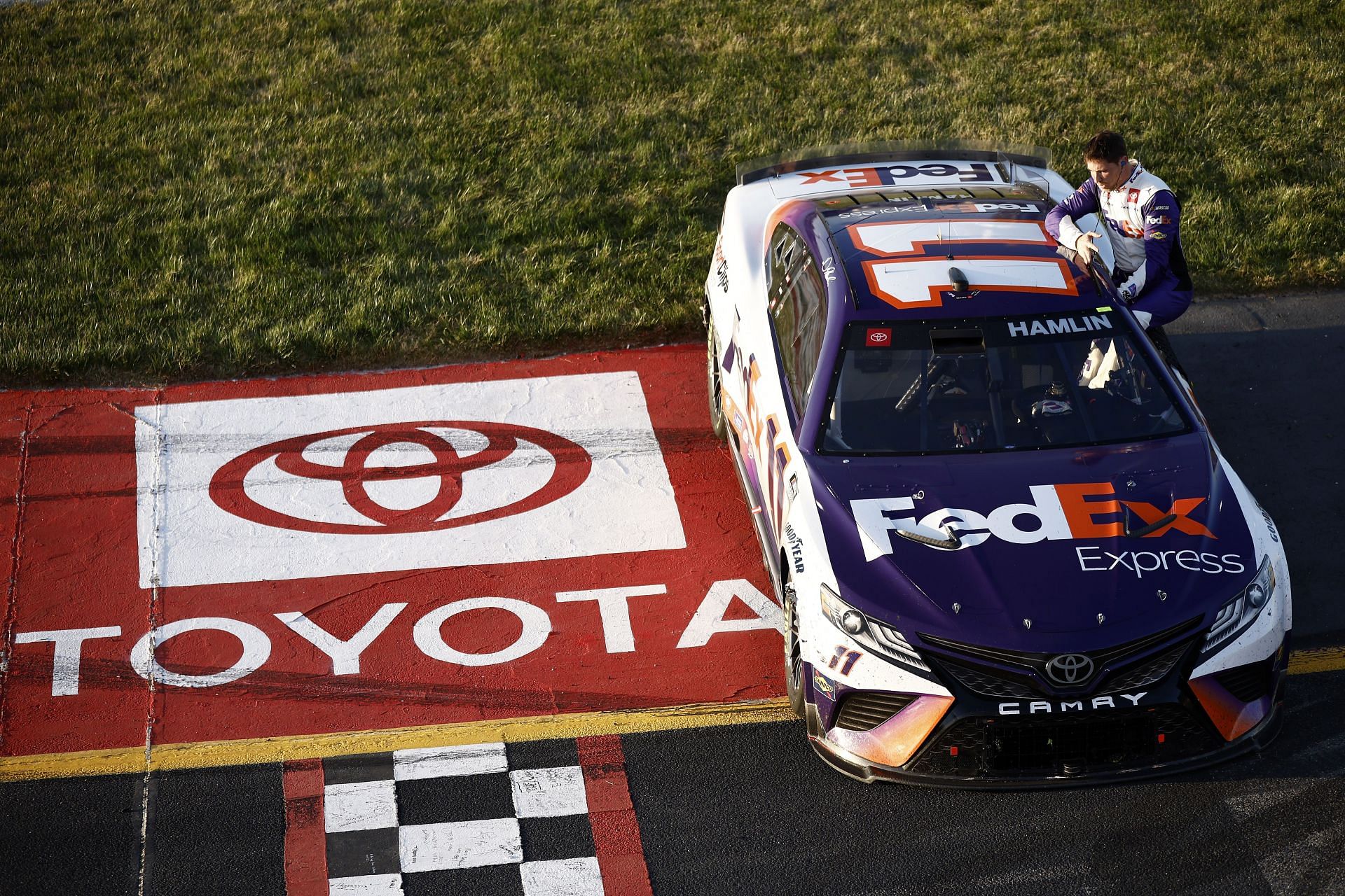 Denny Hamlin celebrates after winning the NASCAR Cup Series Toyota Owners 400 at Richmond Raceway.