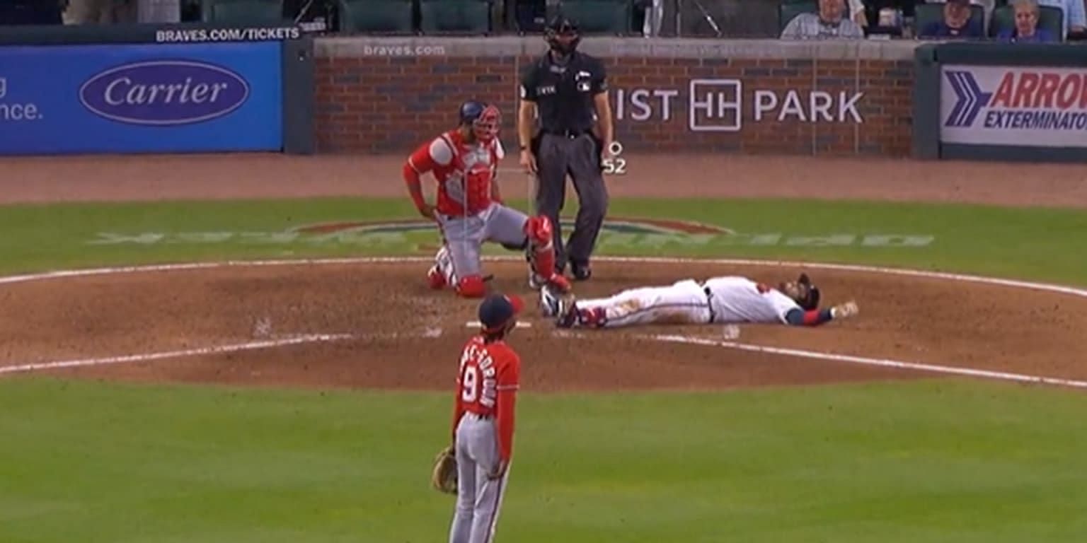 Travis d&#039;Arnaud falls to the ground after being hit by Dee Strange-Gordon