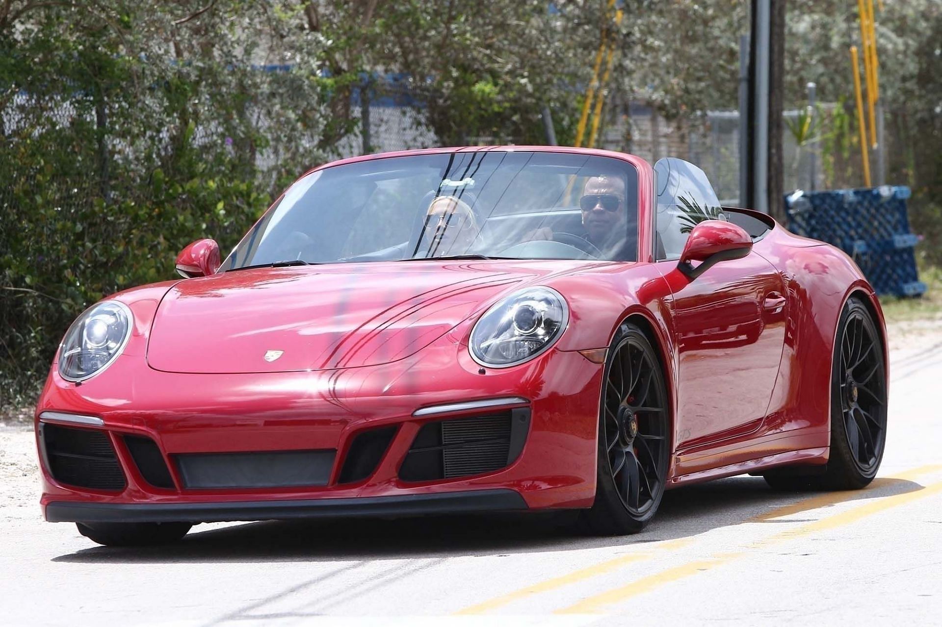 In his red Porsche, Rodriguez and Padgett were also photographed.