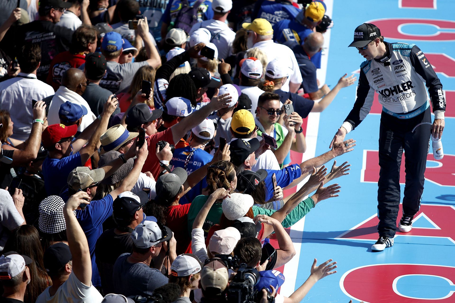 Brad Keselowski greets fans prior to the 2022 NASCAR Cup Series 64th Annual Daytona 500 at Daytona International Speedway in Miami, Florida. (Photo by Sean Gardner/Getty Images)