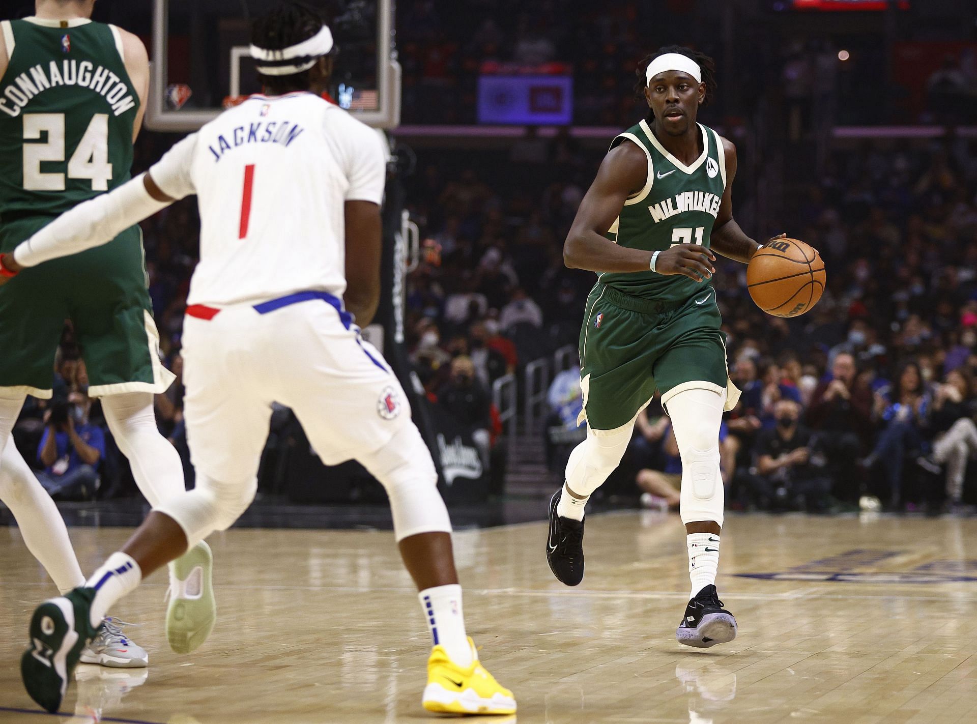 Jrue Holiday taking on Reggie Jackson on a drive