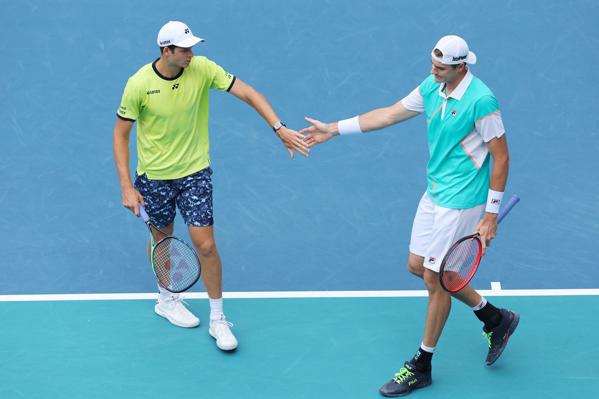 Hubert Hurkacz and John Isner at the 2022 Miami Open