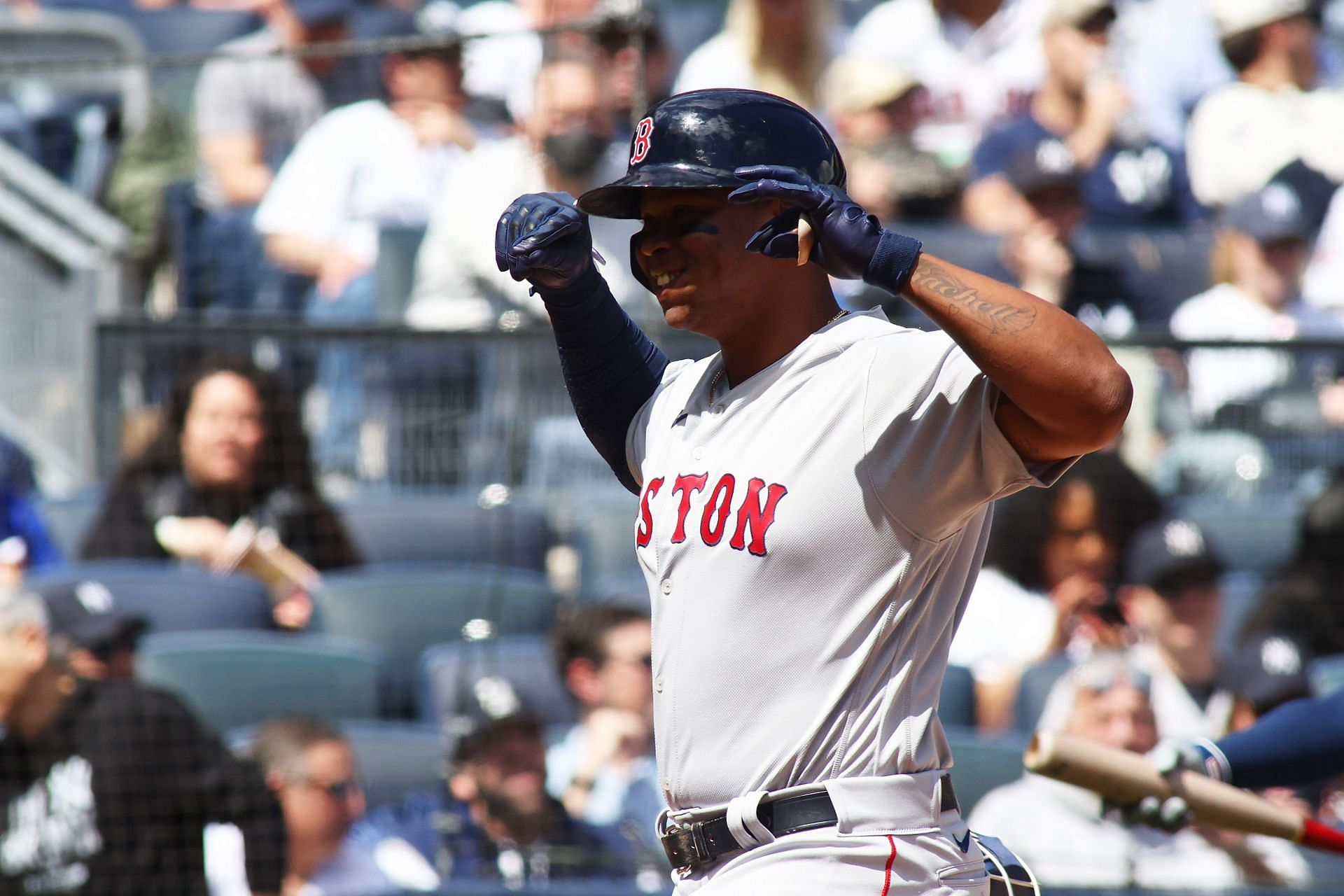 Rafael Devers flexing after a strong hit in New York