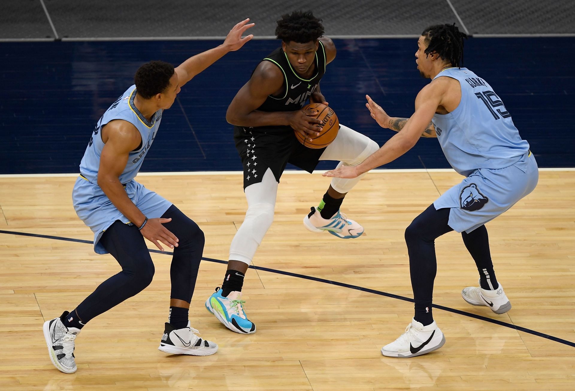 Anthony Edwards of the Timberwolves being double-teamed during a regular season match-up