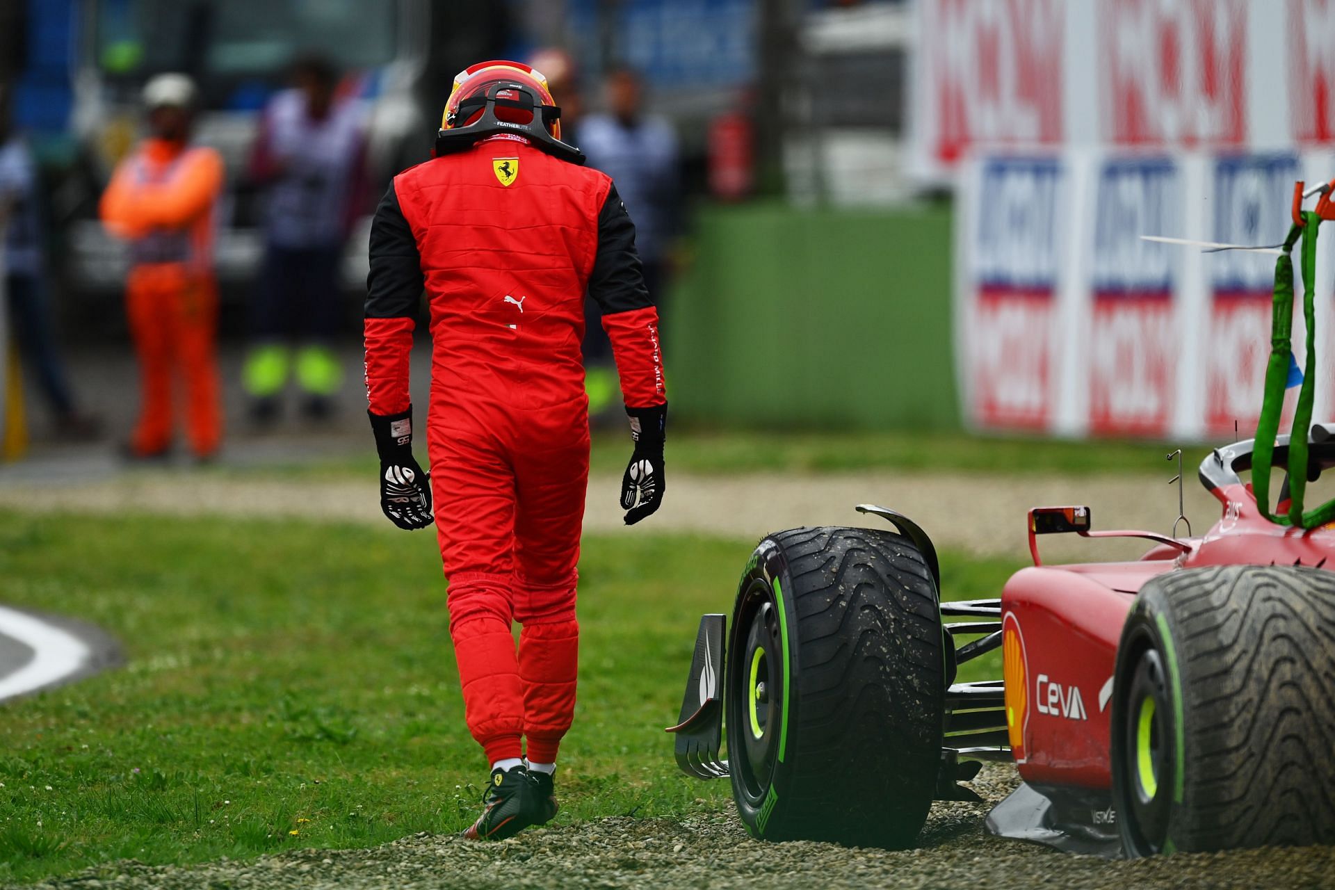 A dejected Carlos Sainz walks away from his Ferrari F1-75 after crashing out of the 2022 F1 Imola GP (Photo by Dan Mullan/Getty Images)