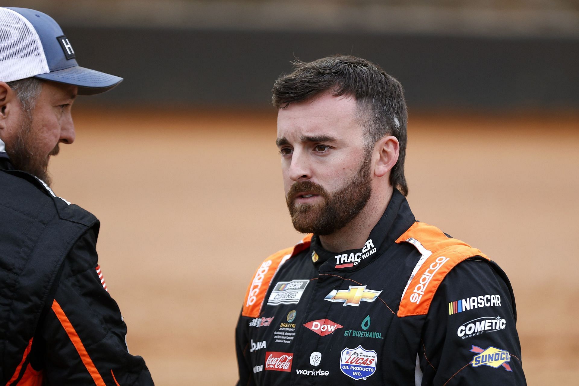 Austin Dillon speaks to a crew member before the 2022 NASCAR Cup Series Food City Dirt Race at Bristol Motor Speedway in Tennessee (Photo by Chris Graythen/Getty Images)