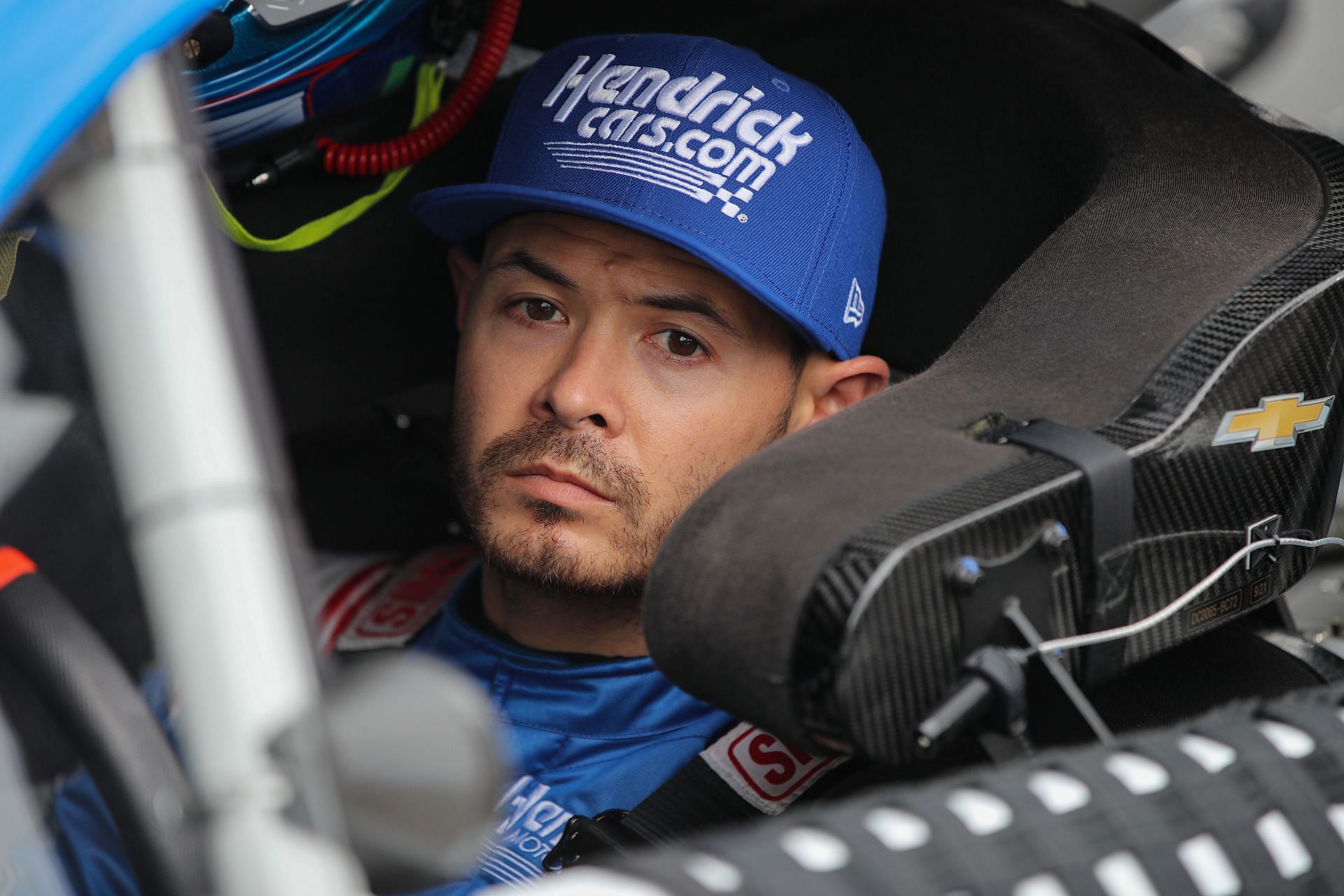 Kyle Larson sits in his car during qualifying for the NASCAR Cup Series Blue-Emu Maximum Pain Relief 400 at Martinsville Speedway.