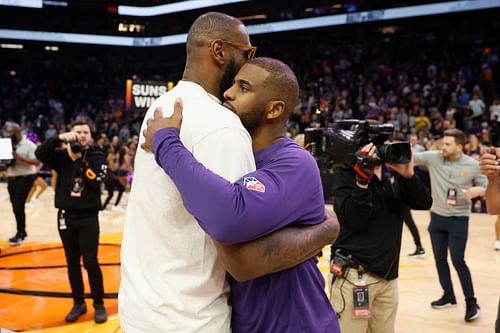 LA Lakers vs. Phoenix Suns: LeBron James, left, and Chris Paul hug after Lakers out of playoff possibility.