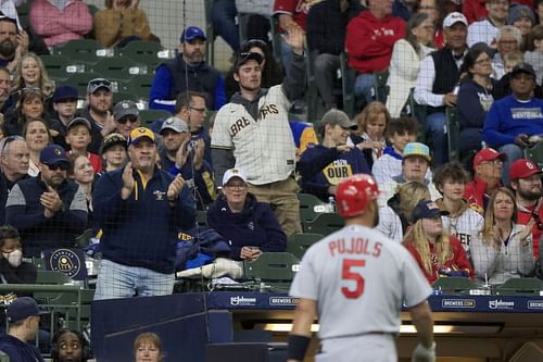 Brewers and Cardinals fans greet Albert Pujols as he belted his 681st home run in Milwaukee Sunday.