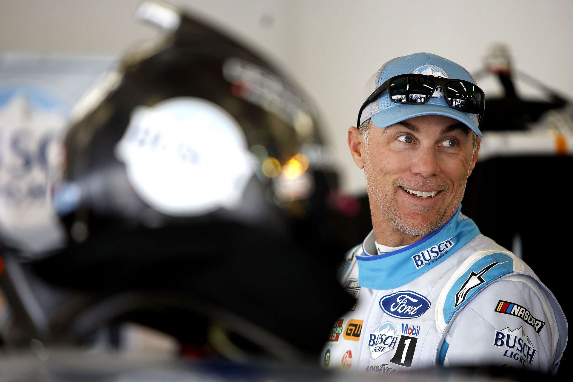 Kevin Harvick waits in the garage area during practice for NASCAR Cup Series 64th Annual Daytona 500 at Daytona International Speedway.