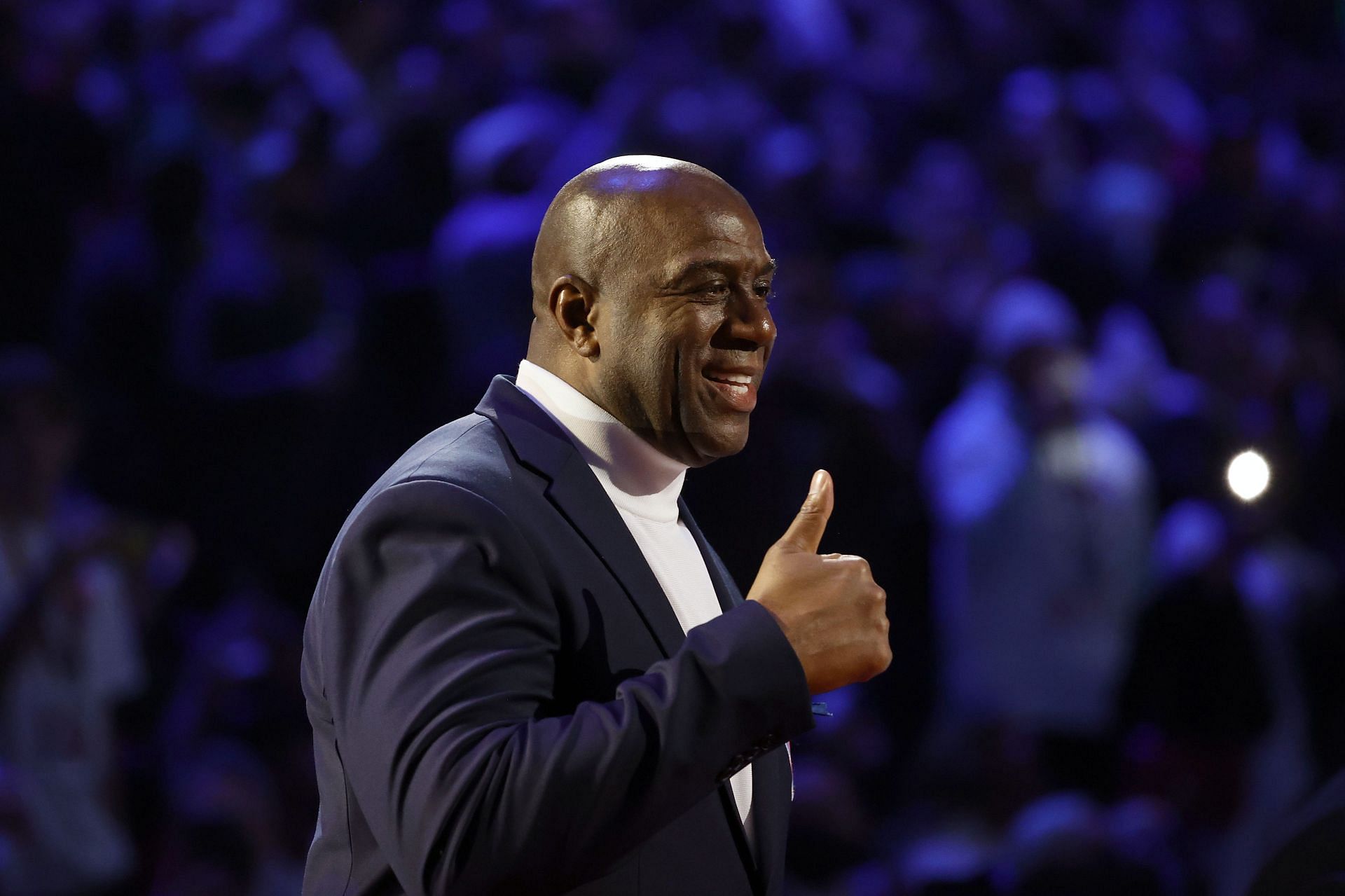 Earvin &quot;Magic&quot; Johnson reacts after being introduced as part of the NBA 75th Anniversary Team