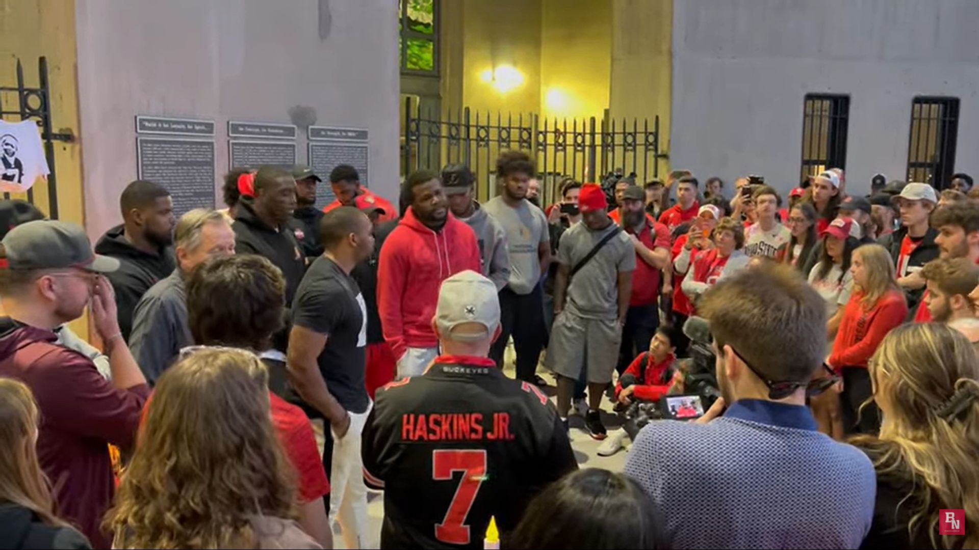 Jones speaking at the vigil for Dwayne Haskins