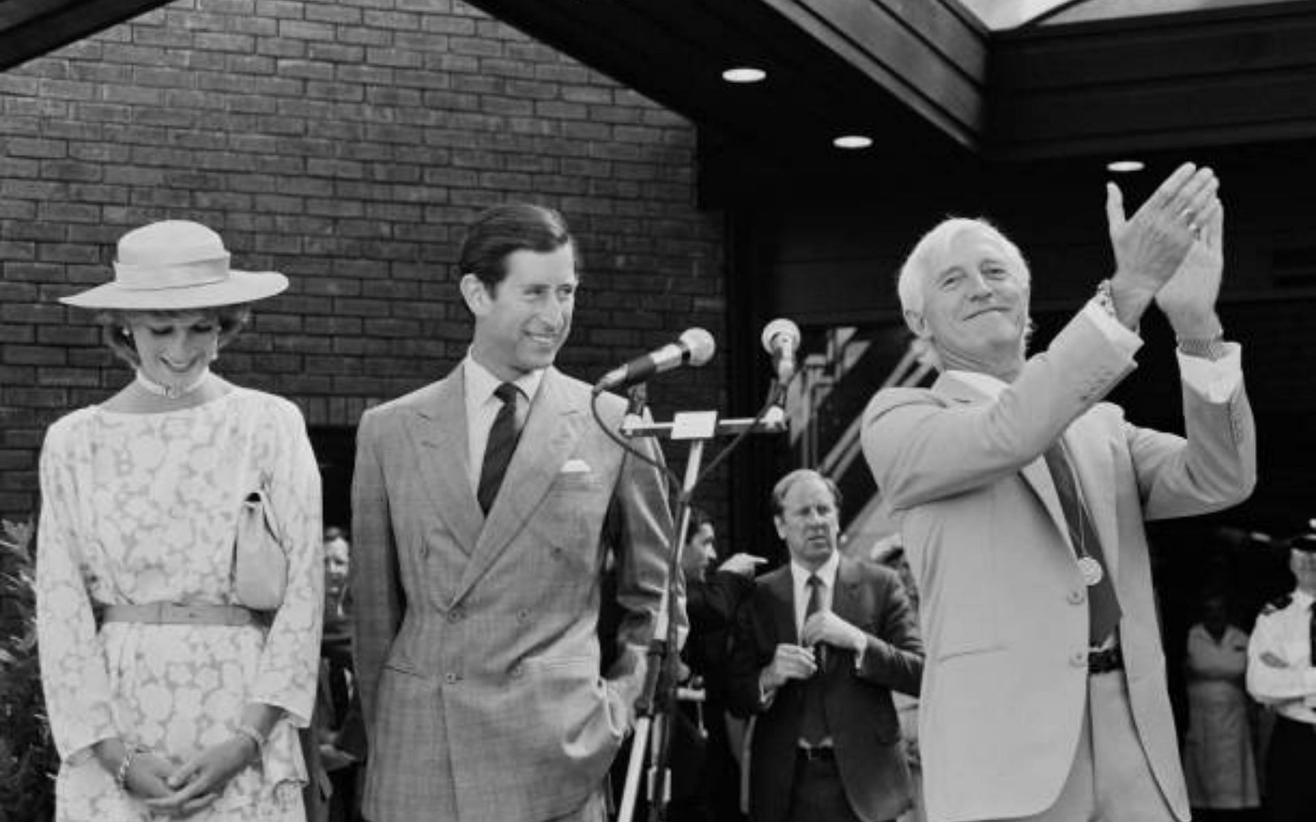 Jimmy Savile with Princess Diana and Prince Charles in 1983 (Image via Hilaria McCarthy/Getty Images)