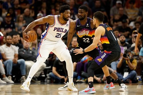 Philadelphia 76ers v Phoenix Suns; Joel Embiid handles the ball against Devin Booker