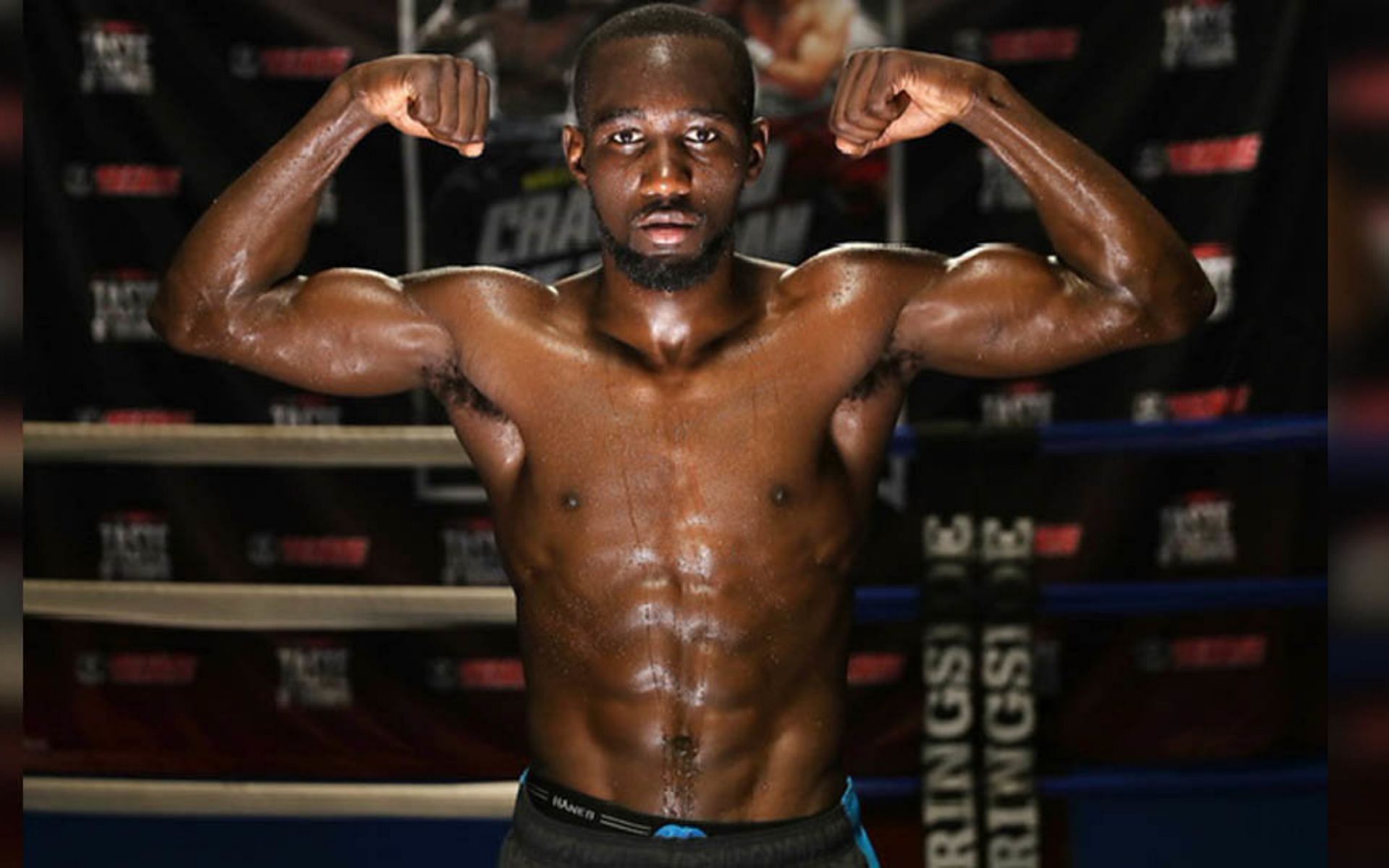 Terence Crawford flexing in the gym