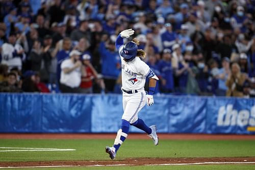 Blue Jays' Bo Bichette celebrates a home run against the Texas Rangers on opening weekend, 2022