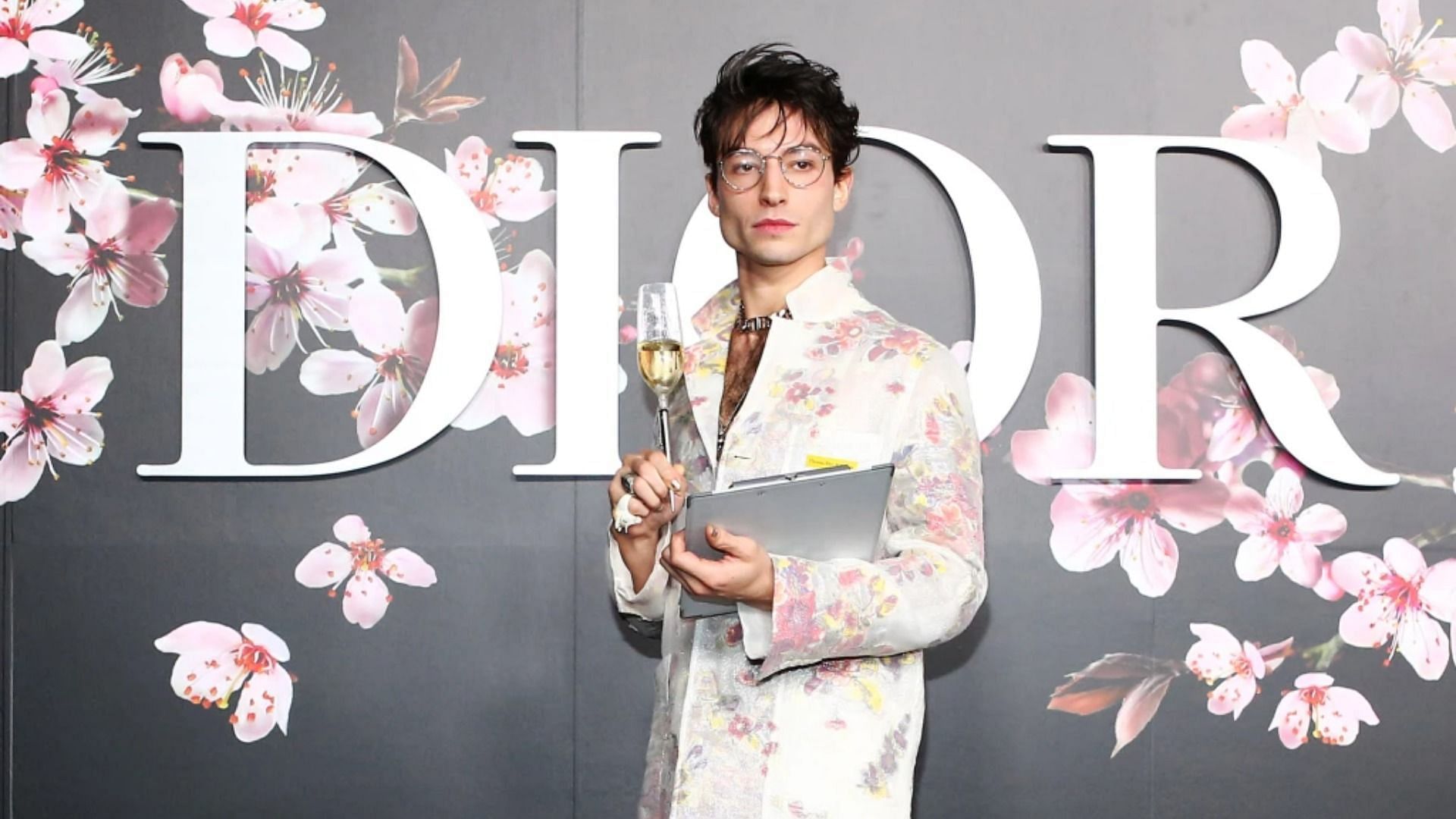 Ezra Miller was previously arrested for assaulting people at a karaoke bar in Hawaii. (Image via Getty Images for Dior)