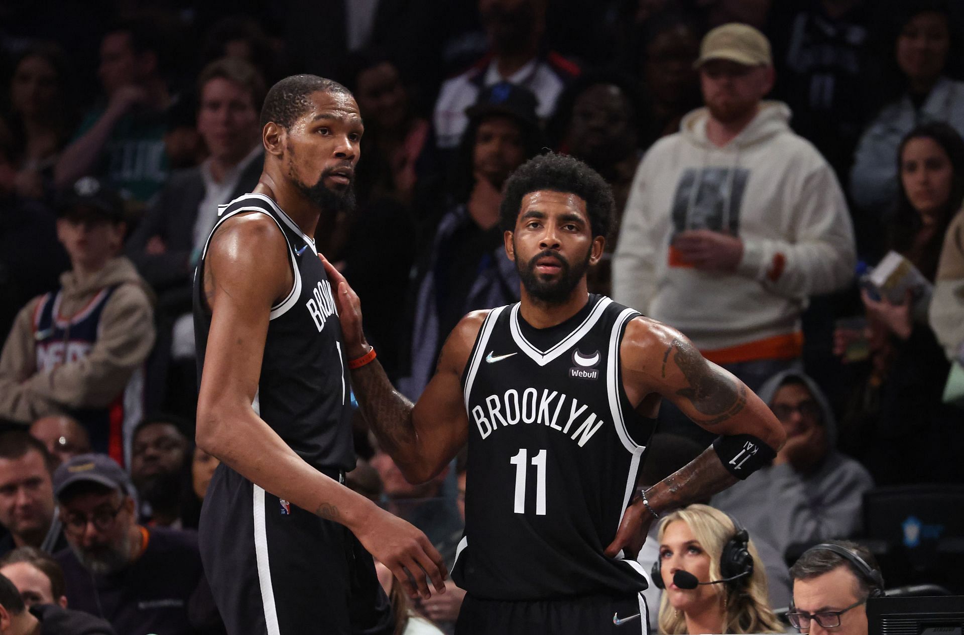 Durant and Irving of the Nets look on in the final seconds of their loss against the Celtics during Game 3.