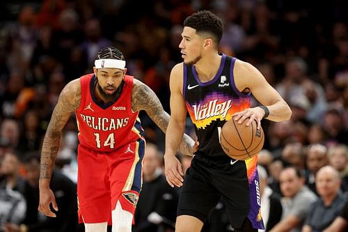 Devin Booker of the Phoenix Suns against Brandon Ingram of the New Orleans Pelicans during Game 1 of the first round of the 2022 NBA playoffs