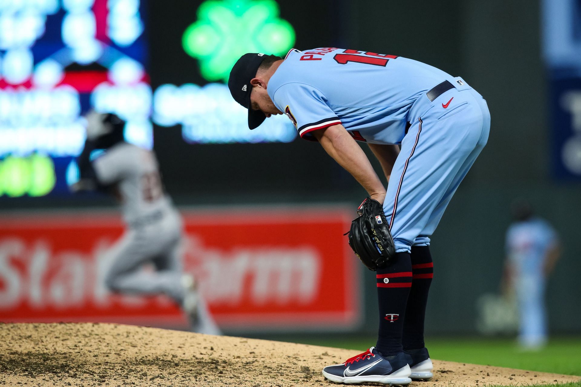 Emilio Pagan #12 of the Minnesota Twins reacts to giving up a three-run home run