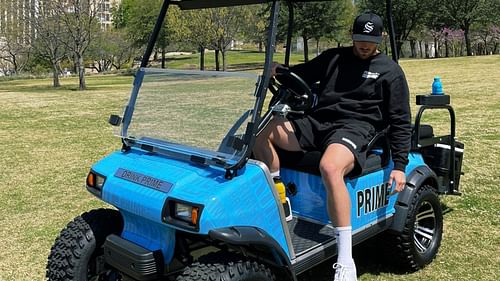 Logan Paul with his custom Prime golf cart