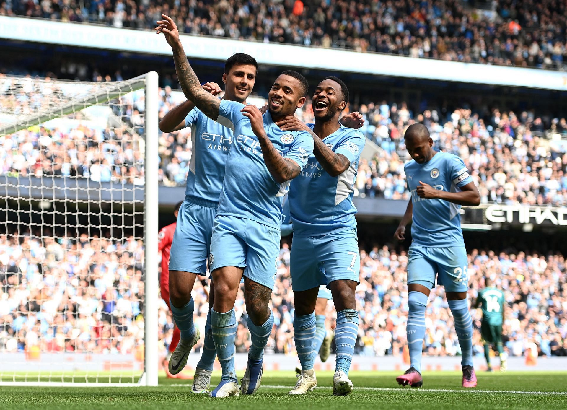 Manchester City players celebrate a goal.