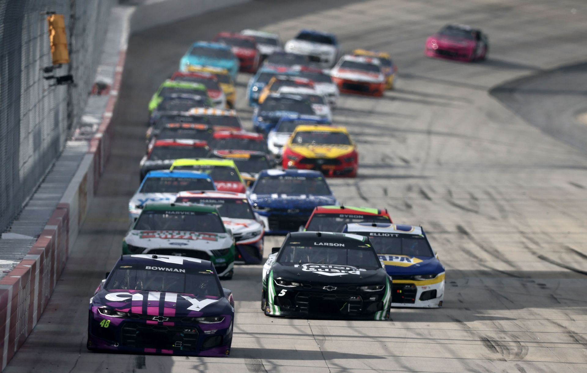 Alex Bowman leads the field during the NASCAR Cup Series Drydene 400 at Dover International Speedway.