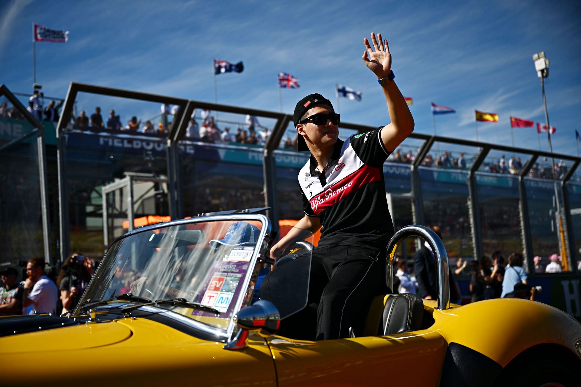Guanyu Zhou of China and Alfa Romeo F1 waves to the crowd on the drivers&#039; parade ahead of the F1 Grand Prix of Australia at Melbourne Grand Prix Circuit on April 10, 2022 (Photo by Clive Mason/Getty Images)