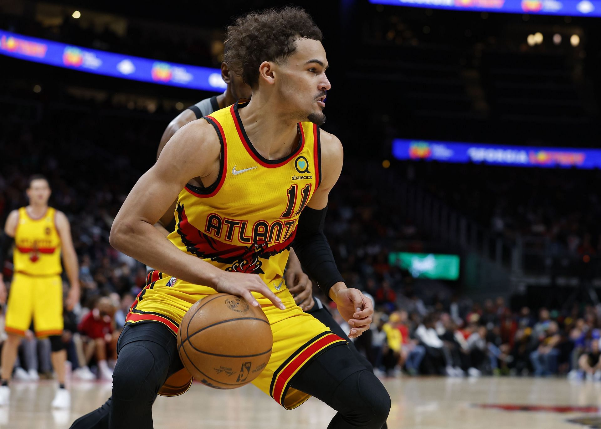 Enter caption Trae Young #11 of the Atlanta Hawks in a game vs. the Brooklyn Nets at State Farm Arena in Atlanta, Georgia.