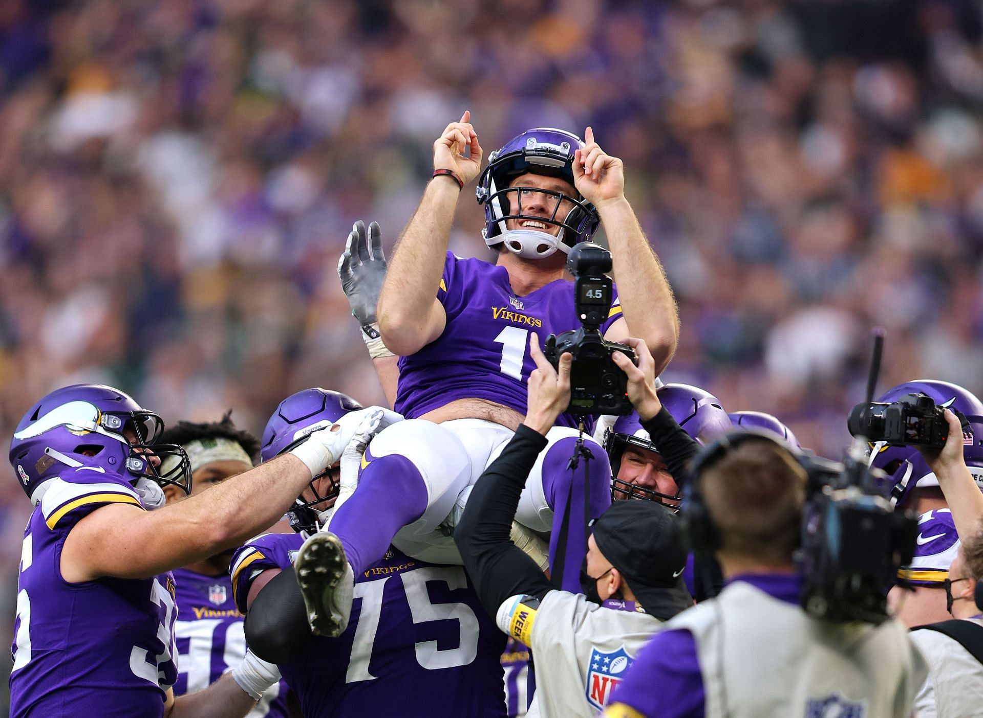 Vikings players celebrate a game-winning field goal against the Packers in 2021
