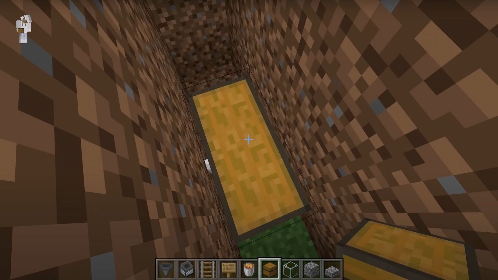 Players should create a large chest in the middle of the hole (Image via JC Playz/YouTube)