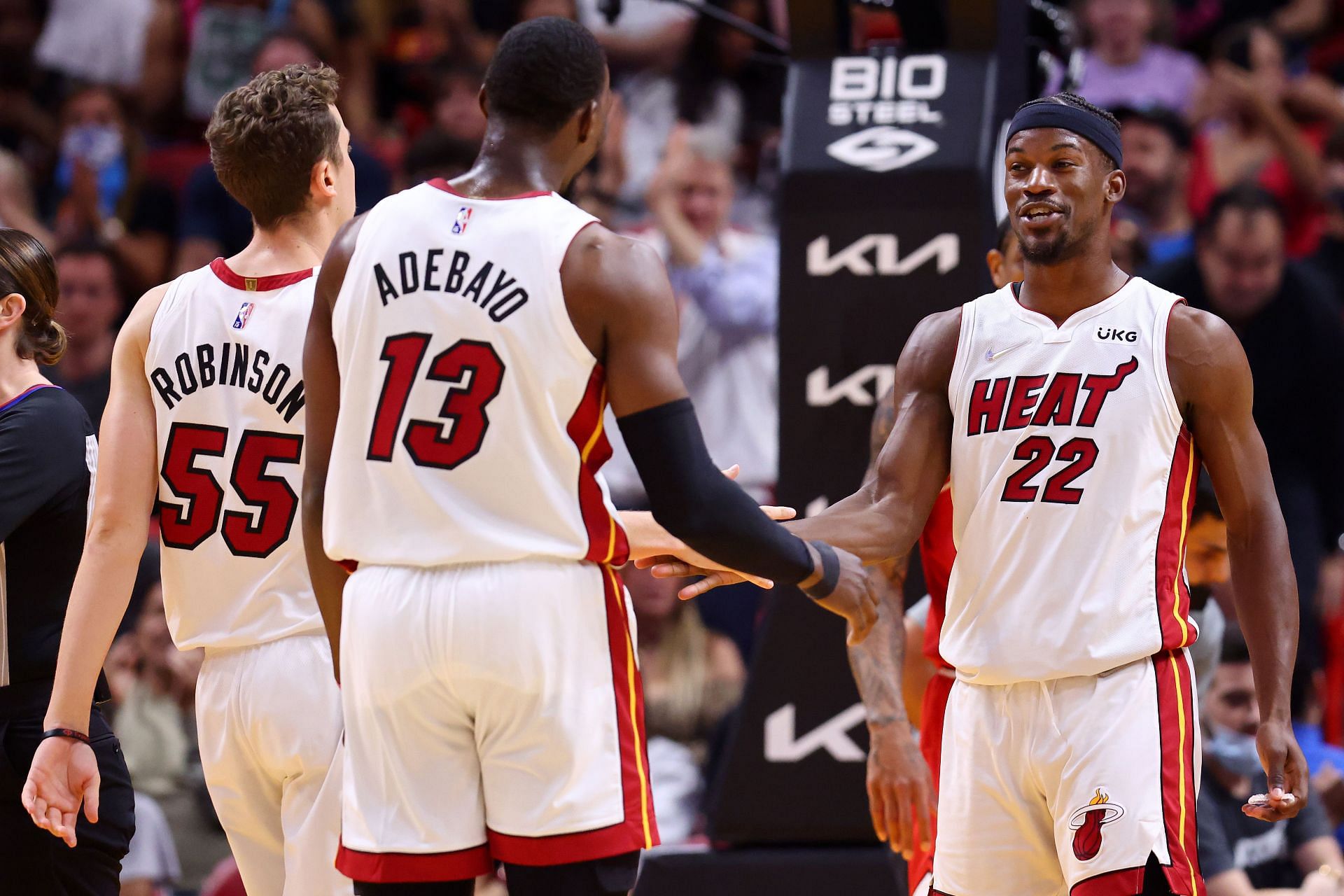 Jimmy Butler #22 of the Miami Heat celebrates with Bam Adebayo #13 against the Chicago Bulls during the second half at FTX Arena on February 28, 2022 in Miami, Florida.