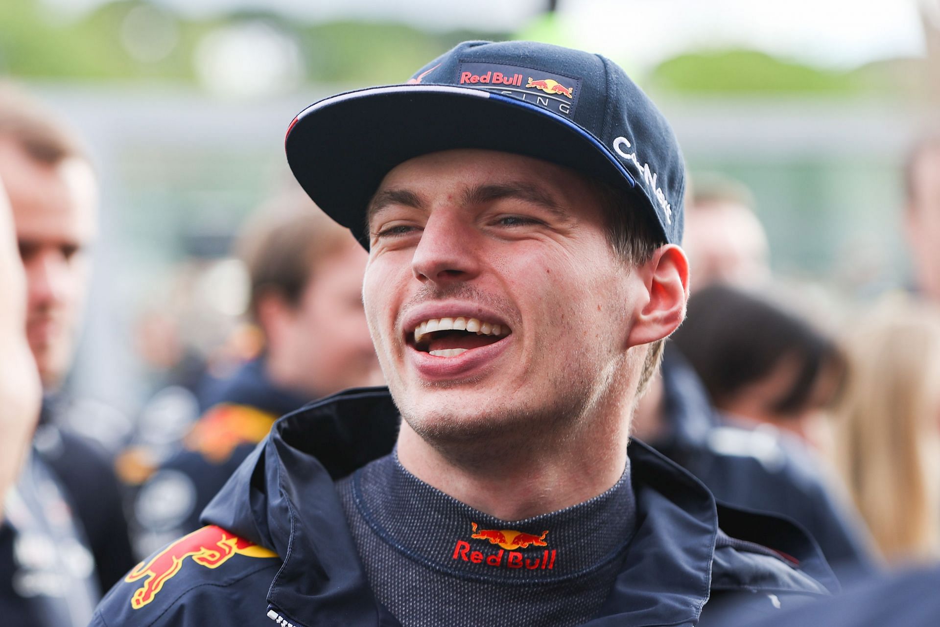 Max Verstappen of Red Bull Racing and The Netherlands smiles before the team celebration photo during the F1 Grand Prix of Emilia Romagna at Autodromo Enzo e Dino Ferrari on April 24, 2022 (Photo by Peter Fox/Getty Images)