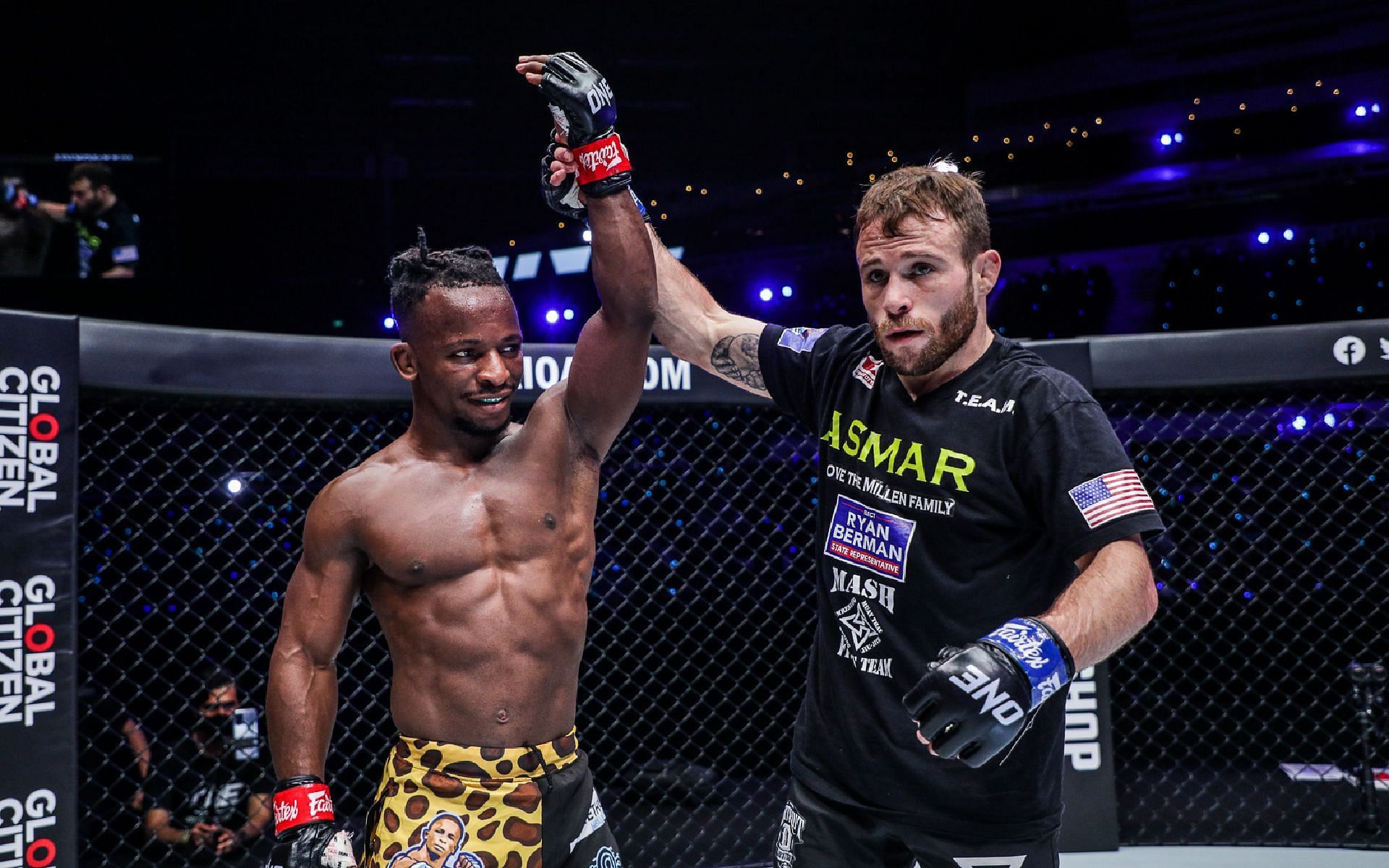 Jarred Brooks (right) celebrates his win together with his opponent Bokang Masunyane (left) after their title eliminator at ONE 156: Eersel vs. Sadikovic. [Photo ONE Championship]