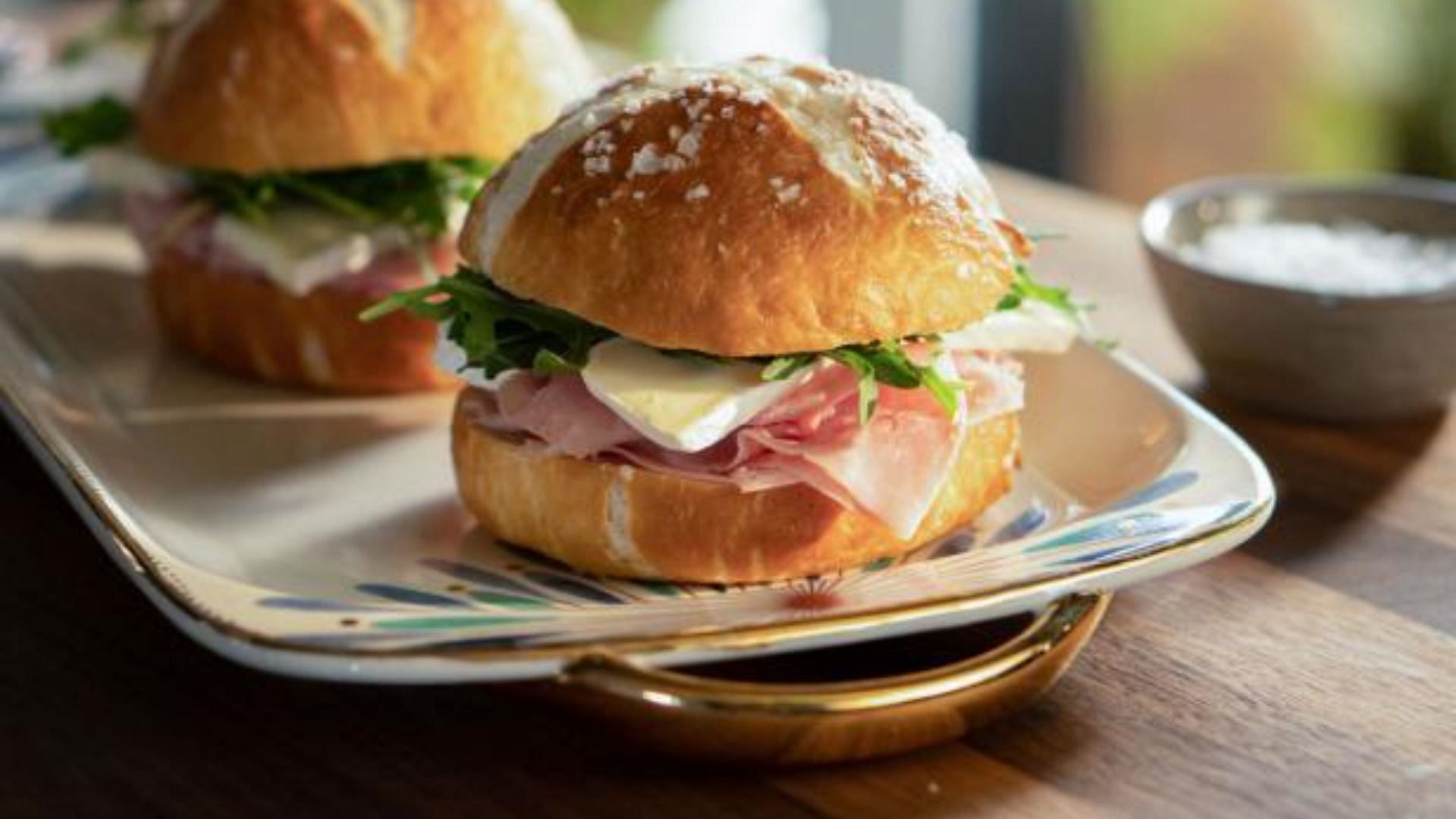 Valerie Bertinelli&#039;s signature Homemade Pretzel Buns with Butter and Ham (Image via Food Network)