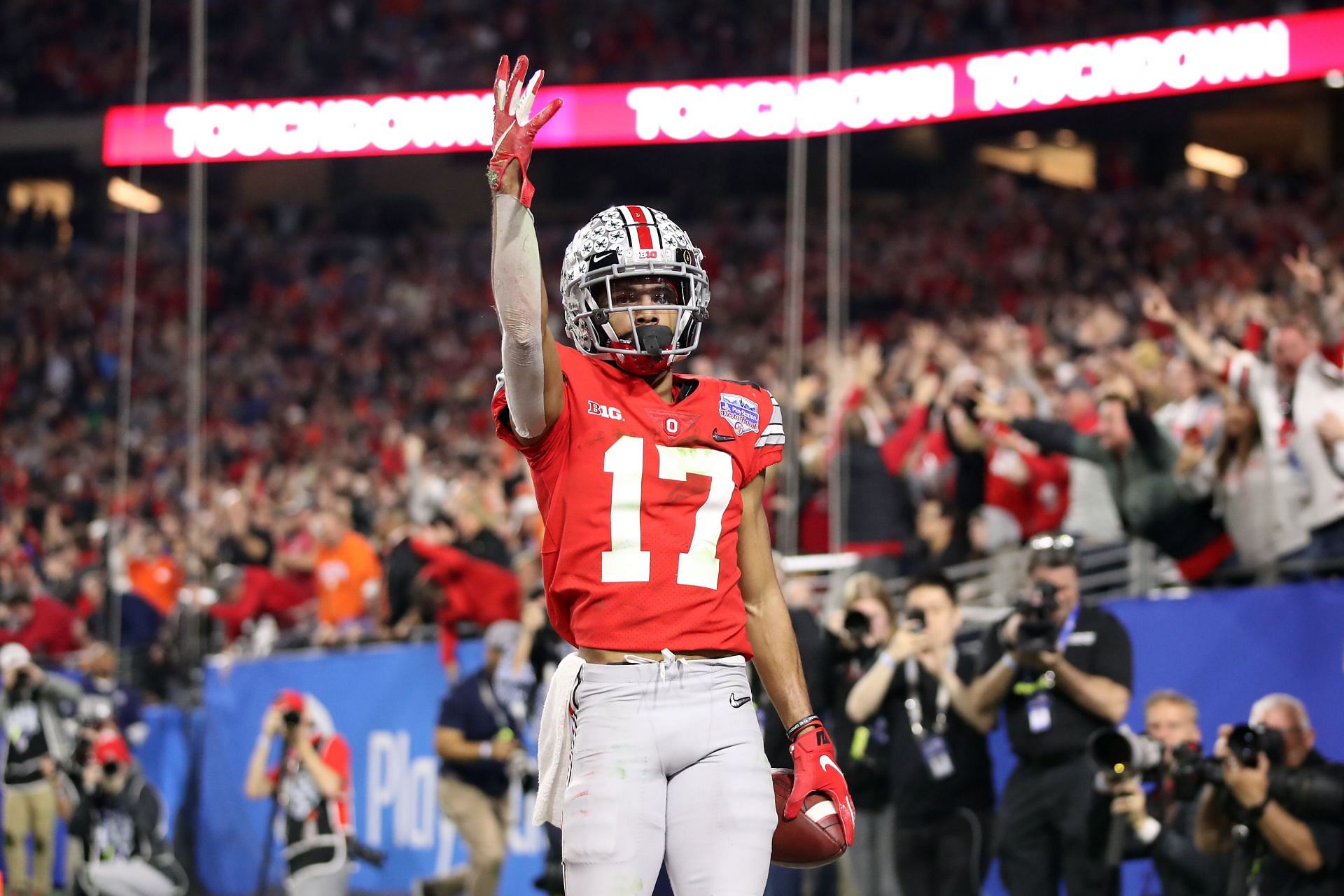 Chris Olave #17 of the Ohio State Buckeyes celebrates his touchdown reception against the Clemson Tigers in the second half during the College Football Playoff Semifinal at the PlayStation Fiesta Bowl at State Farm Stadium on December 28, 2019 in Glendale, Arizona.