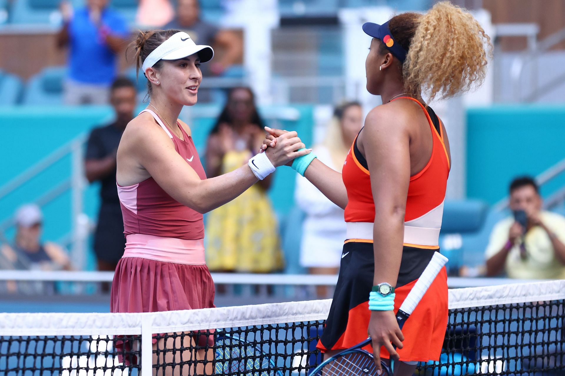 Naomi Osaka shares a handshake with Belinda Bencic at the net following her 4-6, 6-3, 6-4 victory over the Swiss.