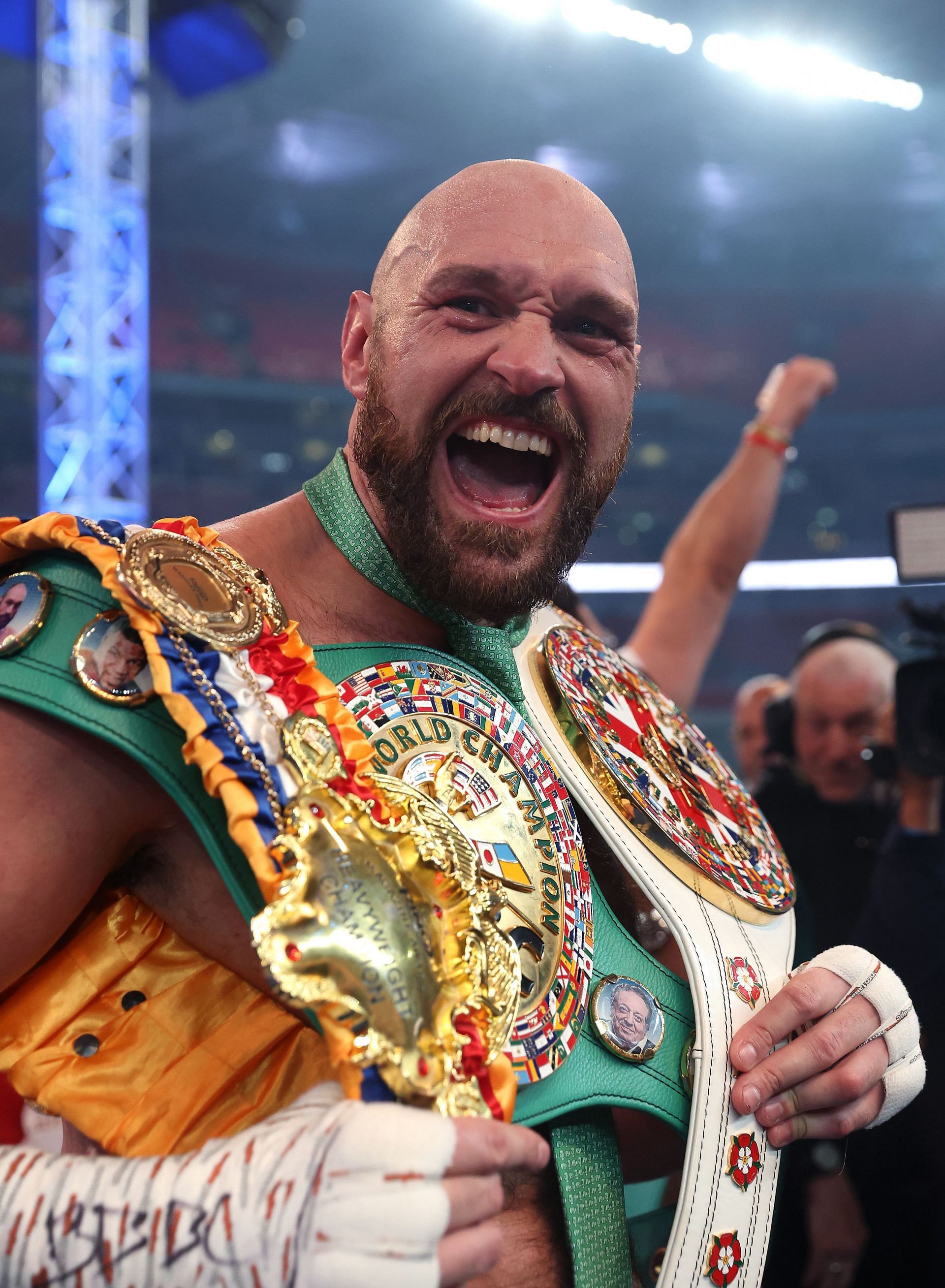 Tyson Fury celebrates after defeating Dillian Whyte.