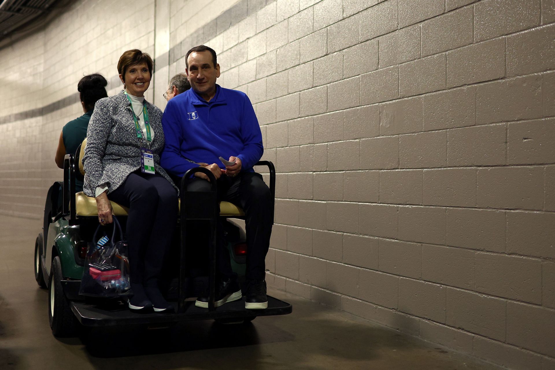 Coach Mike Krzyzewski and his wife, Mickie, ride off into retirement.