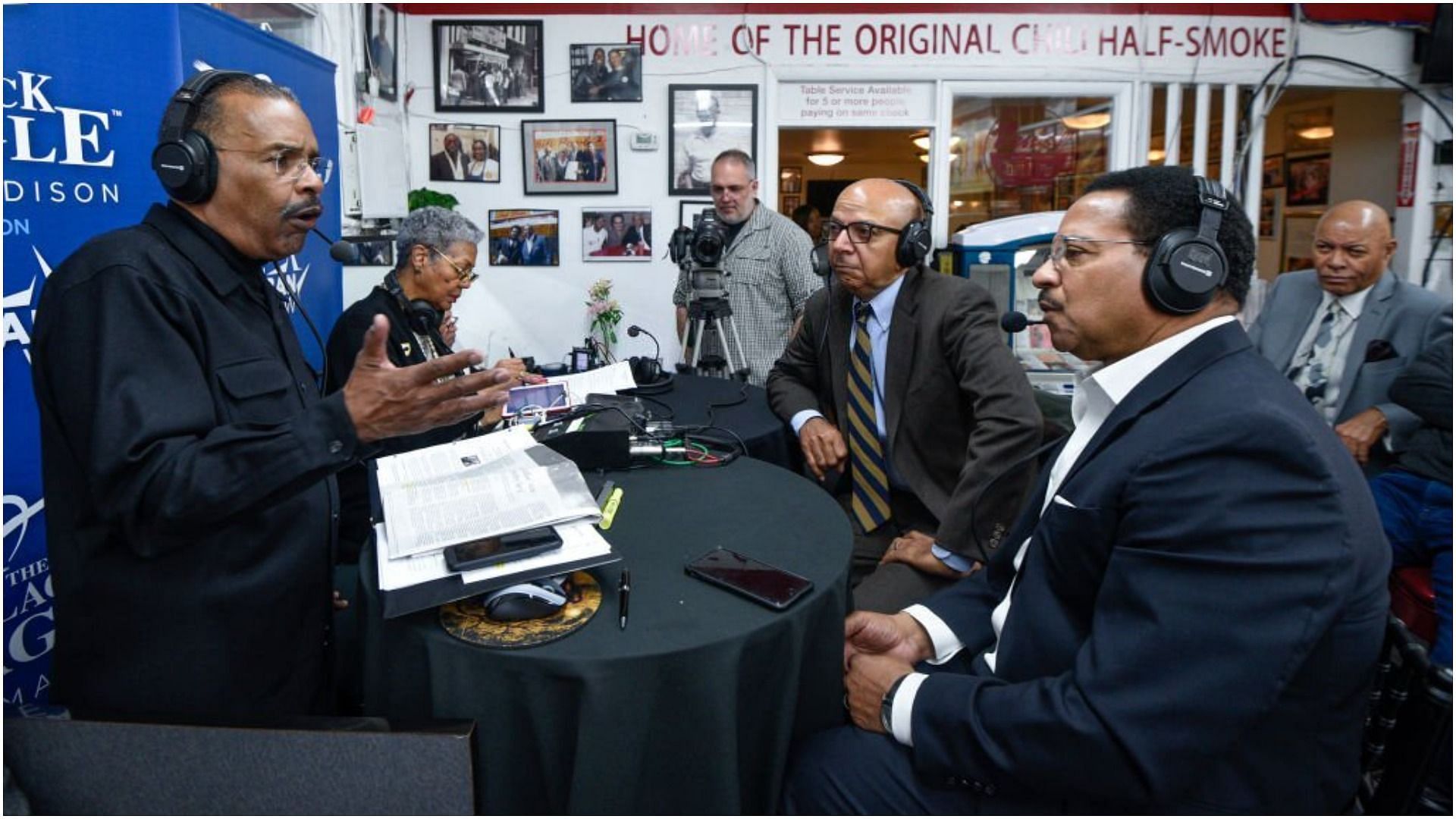 Bruce Johnson speaks with SiriusXM host Joe Madison as he honors the life and legacy of Dr. Martin Luther King Jr. (Image via Leigh Vogel/Getty Images)