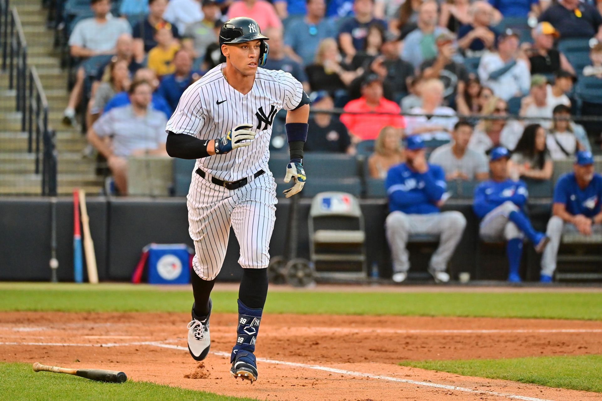 Aaron Judge of the New York Yankees runs to first base after hitting a single against the Toronto Blue Jays