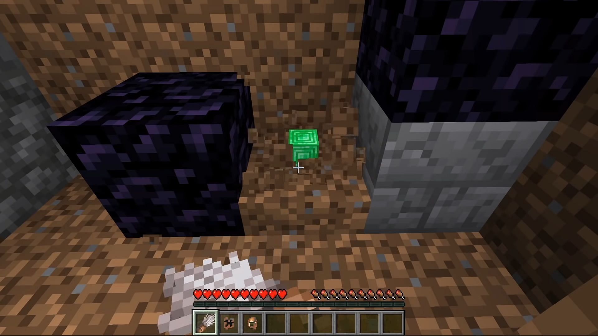 Emerald block out of dirt block (Image via Minecraft)