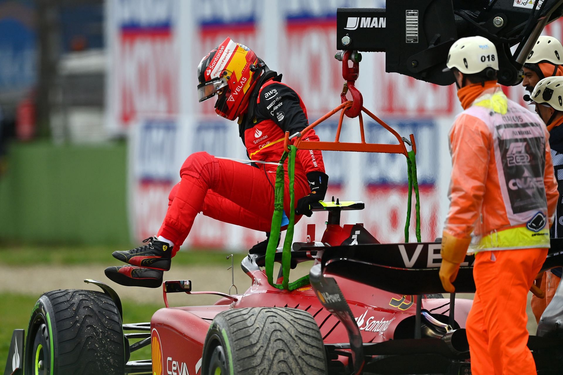 Carlos Sainz jumps out of his beached car at the F1 Grand Prix of Emilia Romagna