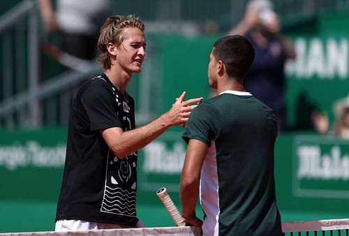 Sebastian Korda shakes hands with Carlos Alcaraz after his second-round victory in Monte-Carlo.