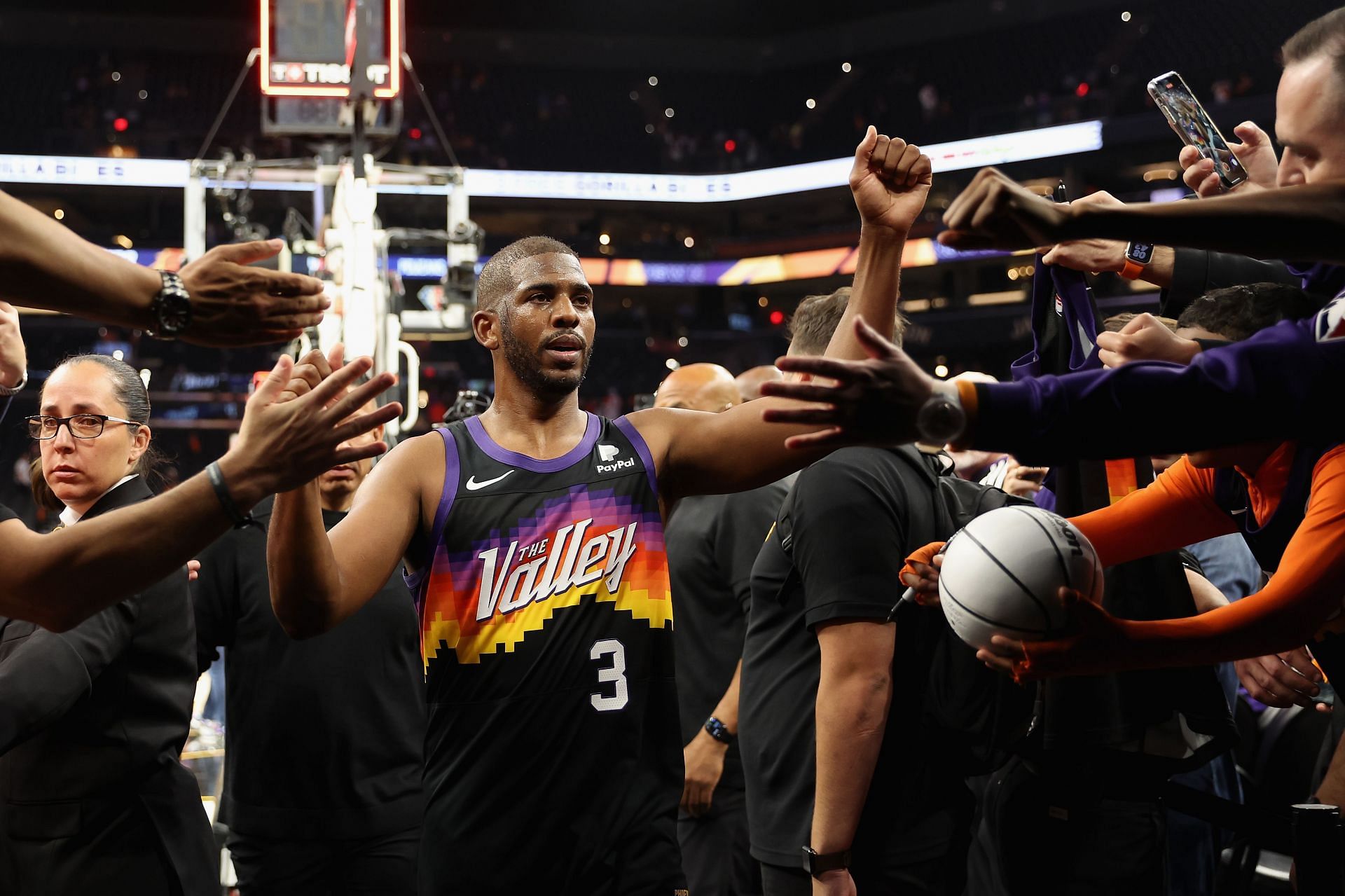 Chris Paul of the Phoenix Suns high fives fans after Game 1.