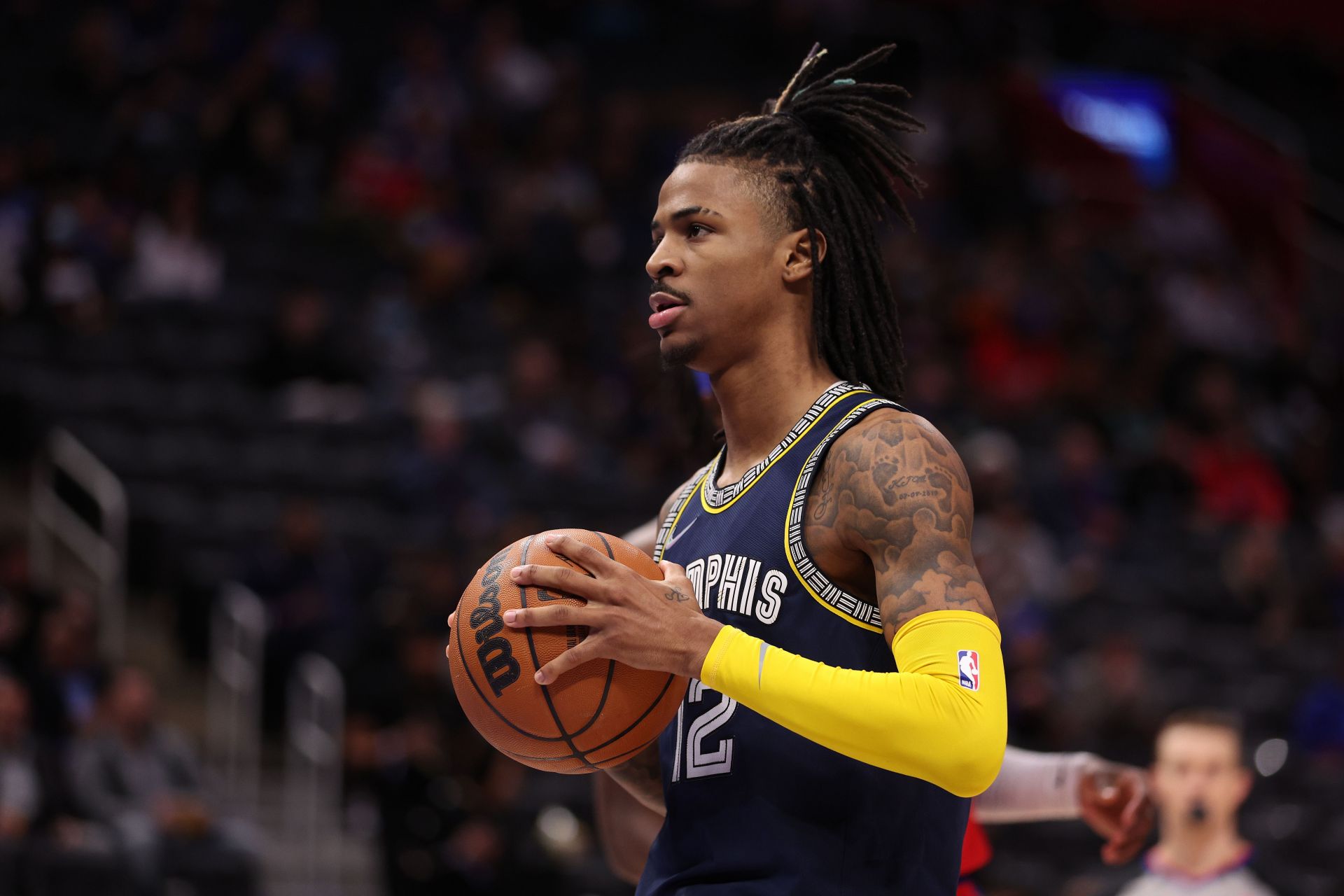 Ja Morant #12 of the Memphis Grizzlies plays against the Detroit Pistons at Little Caesars Arena on February 10, 2022 in Detroit, Michigan.