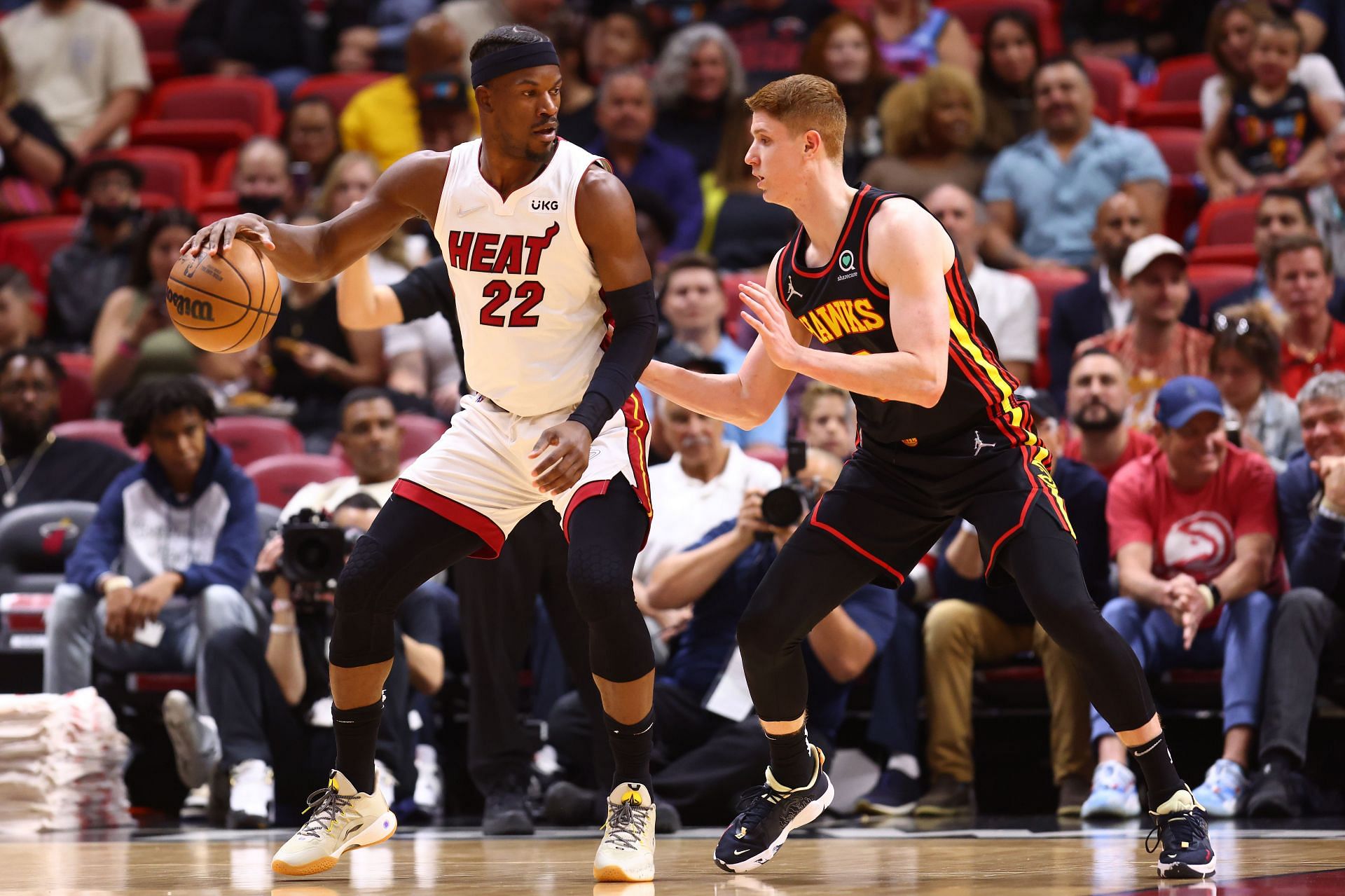 Jimmy Butler #22 of the Heat posting up the Hawks&#039; Kevin Huerter