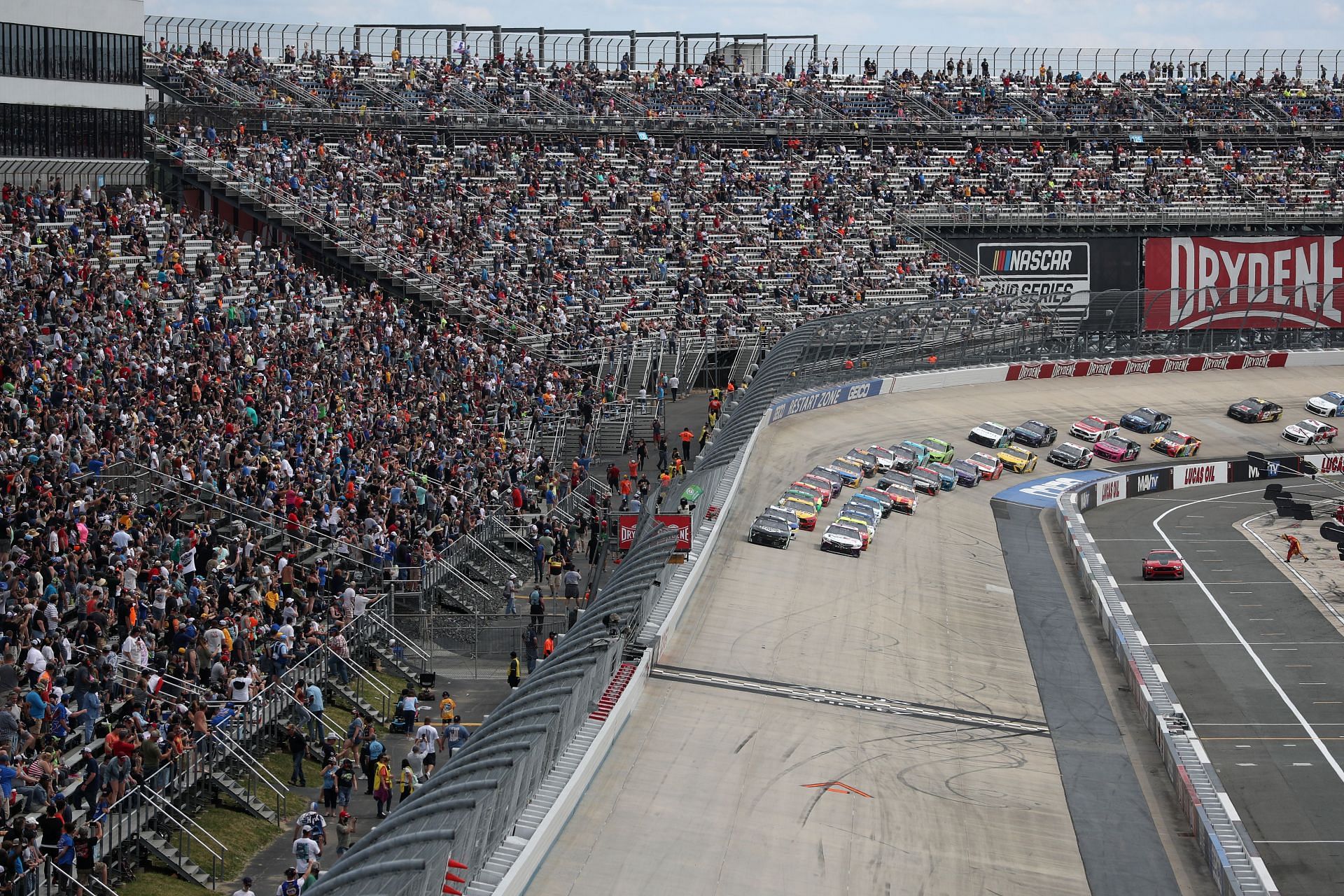 A general view of cars racing during the NASCAR Cup Series Drydene 400 at Dover International Speedway. (Photo by James Gilbert/Getty Images)