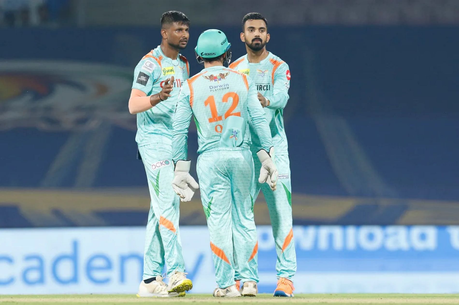 K Gowtham (left) with Quinton de Kock and LSG skipper KL Rahul. Pic: IPLT20.COM