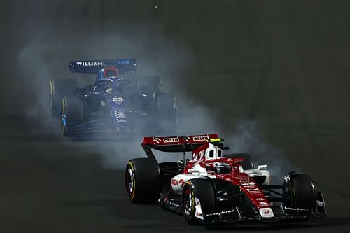 Guanyu Zhou (#24) Alfa Romeo C42 defending against Alex Albon (#23) Williams FW44 after a poor start, 2022 Saudi Arabian GP